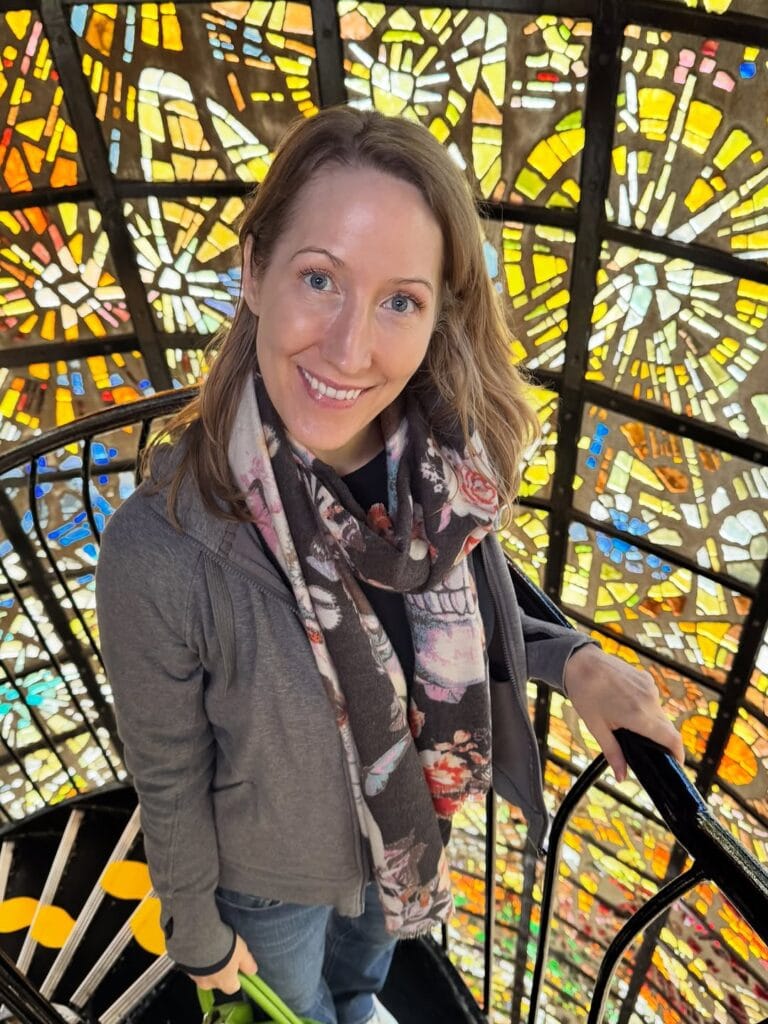 Erin Warner on the spiral staircase inside the colorful stained glass Symphonic Sculpture at Hakone Open Air Museum