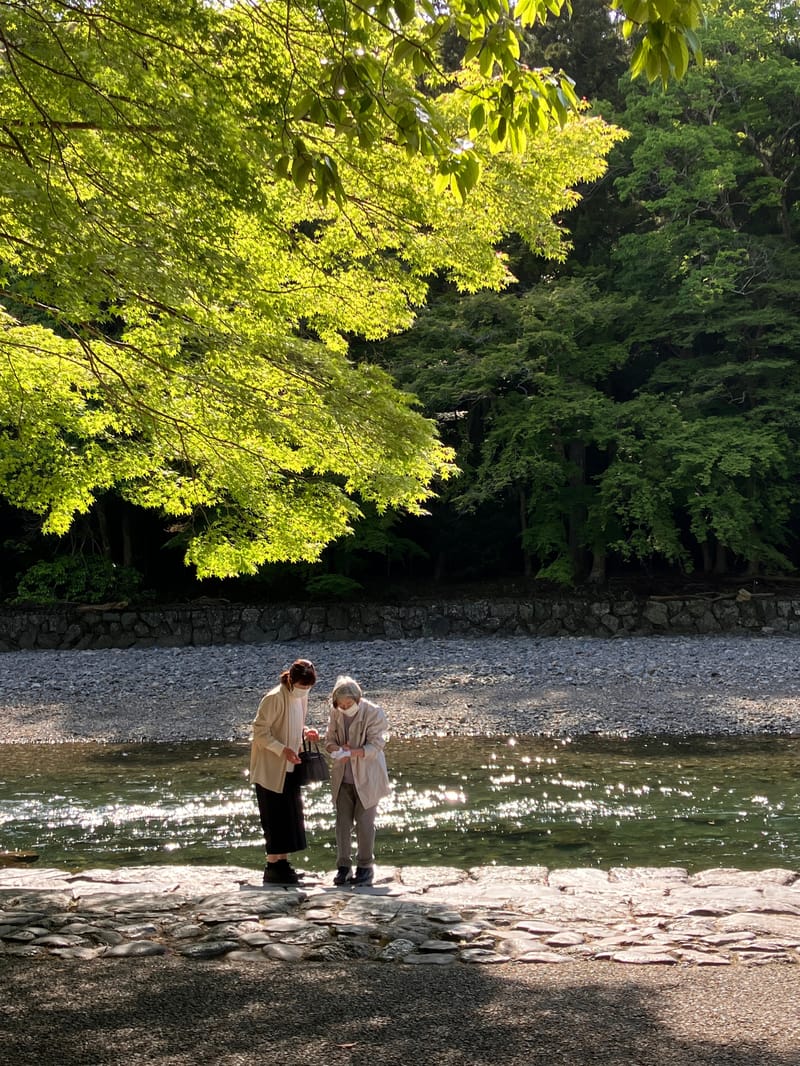 Purifying in the Isuzu River before entering the shrine