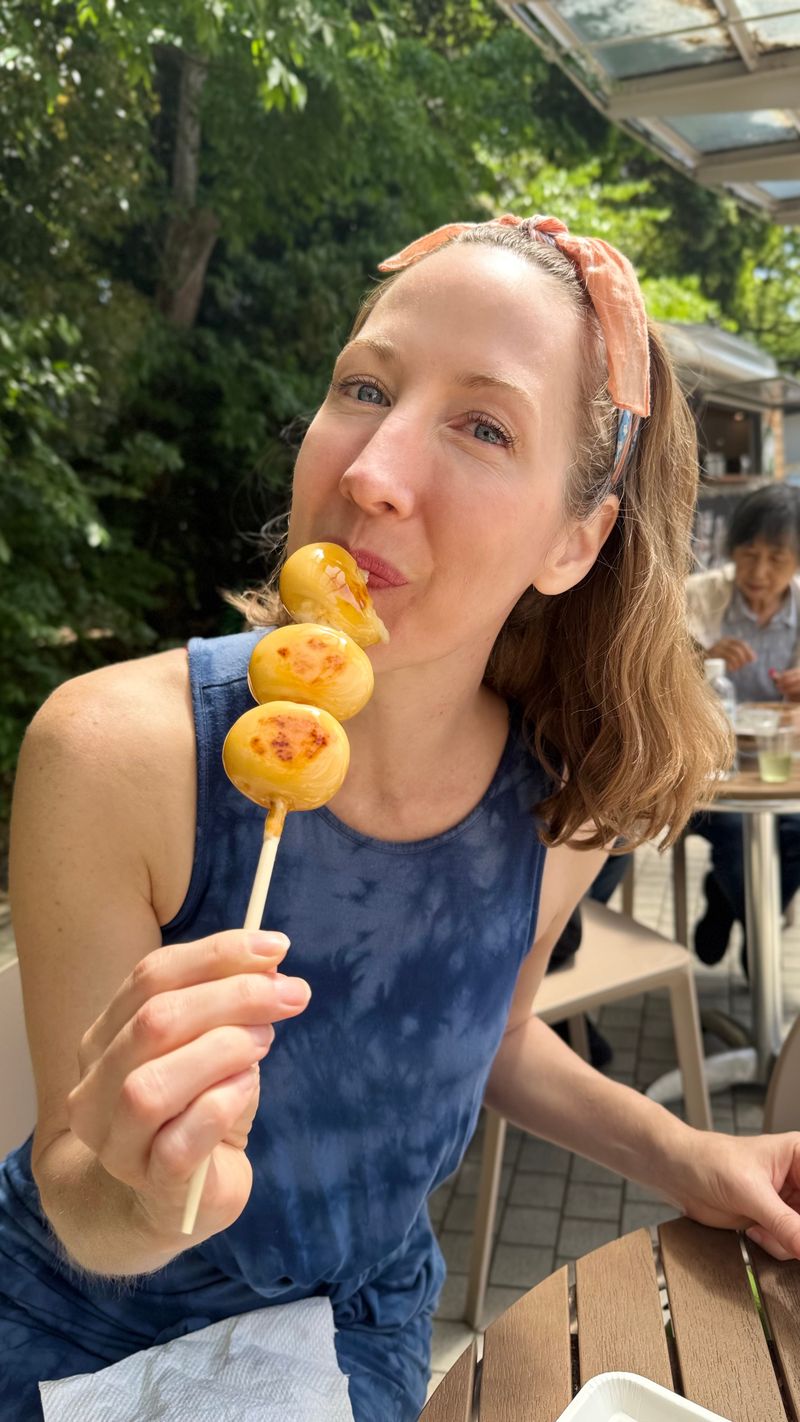 Eating dango, grilled mochi dumplings, at Yoyogi Park in Tokyo